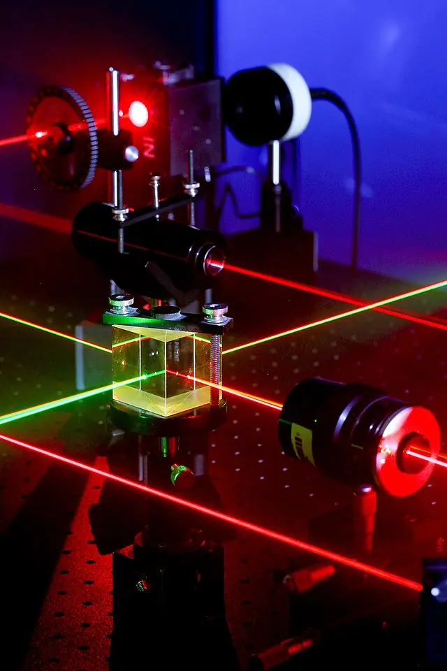 NORCO, Calif. (April 19, 2011) Various optical components are aligned using eye-safe visible lasers by Naval Surface Warfare Center (NSWC), Corona Division Microwave/Electro-Optic (MS32) Electronics Engineer Daniel King. Under the Navy Metrology Research and Development Program, NSWC Corona's E-O Group has developed and patented two calibration standards for support of laser designator and rangefinder test sets. The laser transmitter supports standards, keeps ordnance on target and reduces the cost of maintenance for the fleet. (U.S. Navy photo by Greg Vojtko/Released)
