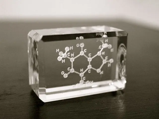 Sculpture of the caffeine molecule made by laser marking inside of glass