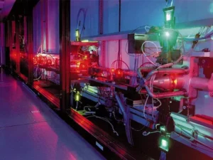 An atomic vapor laser isotope separation experiment at LLNL. Green light is from copper vapor pump laser used to pump a highly tuned dye laser (producing the orange light). Image taken from LLNL document "Laser Programs, the first 25 years". http://www.osti.gov/bridge/servlets/purl/16710-UOC0xx/native/16710.pdf