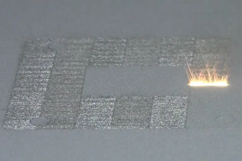 A 3D printer of the laser powder-bed fusion type, in action. Laser powder-bed fusion adds successive layers of metal powder and then uses a laser to melt each layer into place on the part being created. Image: NIST / KTH.