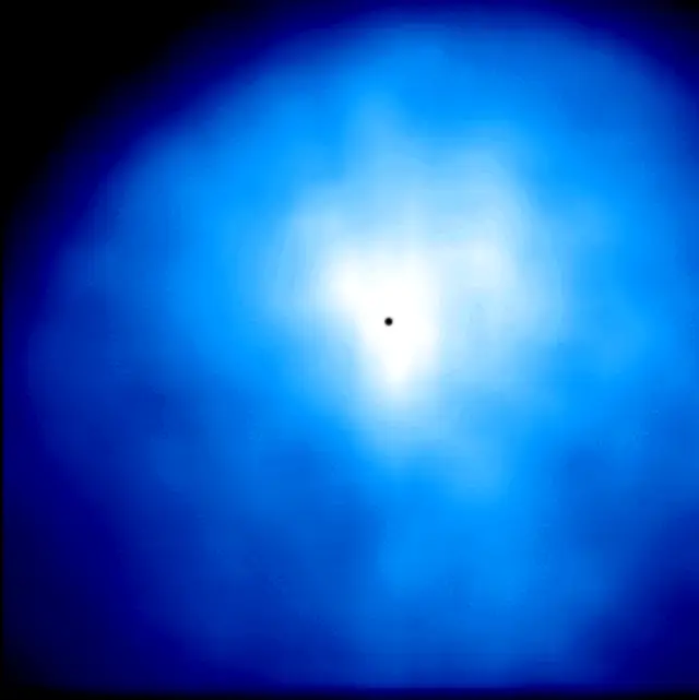 Image of Comet Hyakutake shown in blue, was taken with an ultraviolet "Woods" filter image that shows the distribution of scattered ultraviolet radiation from hydrogen atoms in the inner coma.